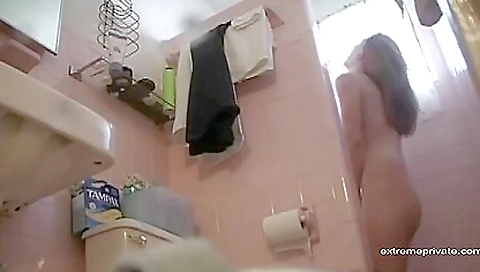 Busty stepdaughter with big natural tits is doing a shower