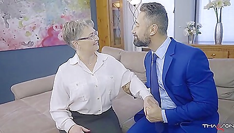 Horny blonde granny with long black hair is alone with herself