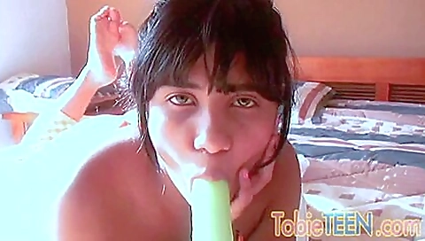 Ebony teen in lingerie and pussy boots enjoys a dildo