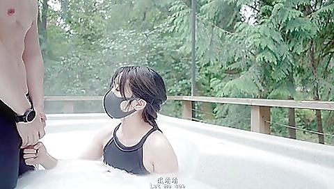 Japanese girl enjoys outdoor beauty around her in woods