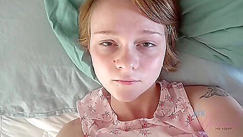 Sexy blonde with a tattooed body gets on the bed and fucks