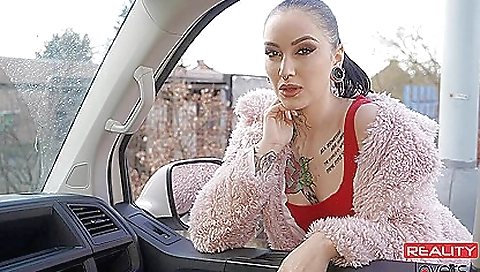 Horny girl riding her boyfriend's cock in an open top